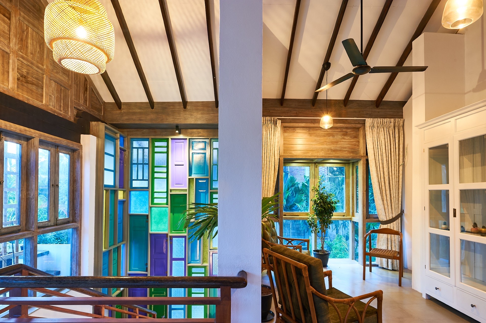 Bedroom with canopy bed and large windows